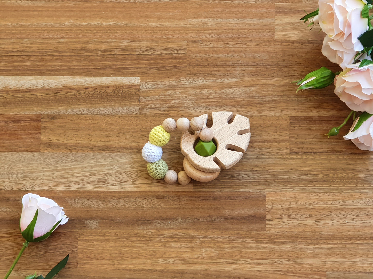 wood and silicone beaded teether ring toy with wooden leaf