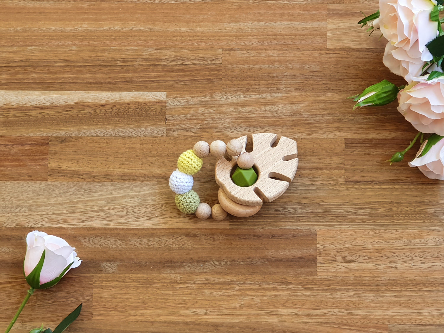 wood and silicone beaded teether ring toy with wooden leaf