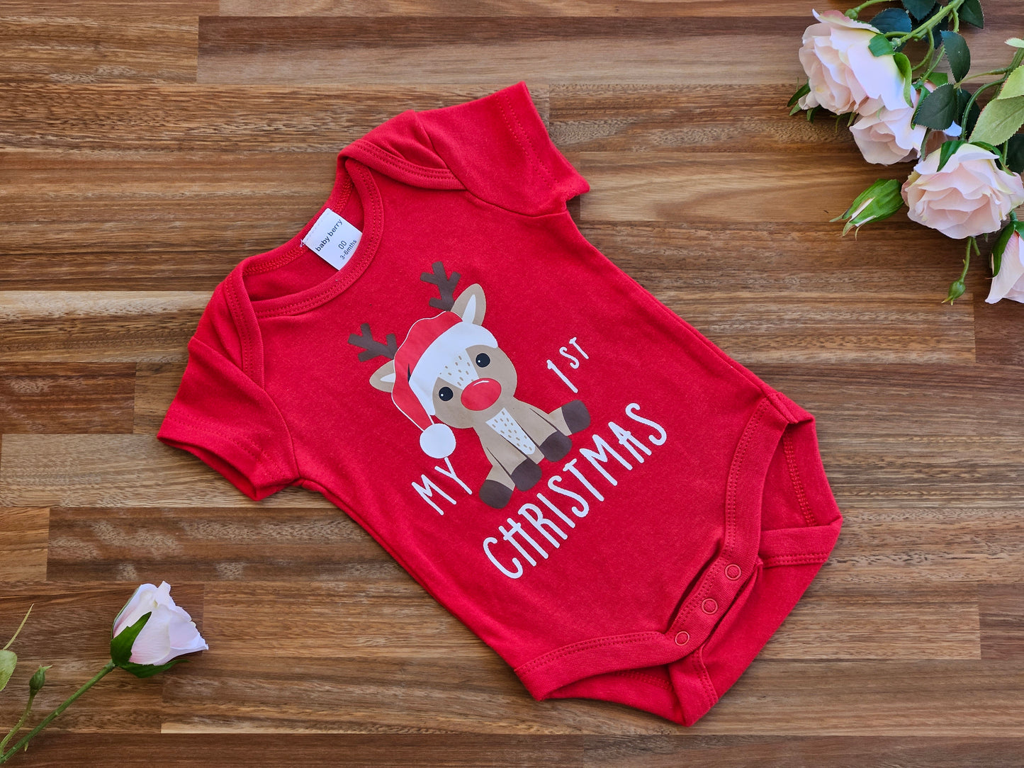 Red romper with Reindeer print