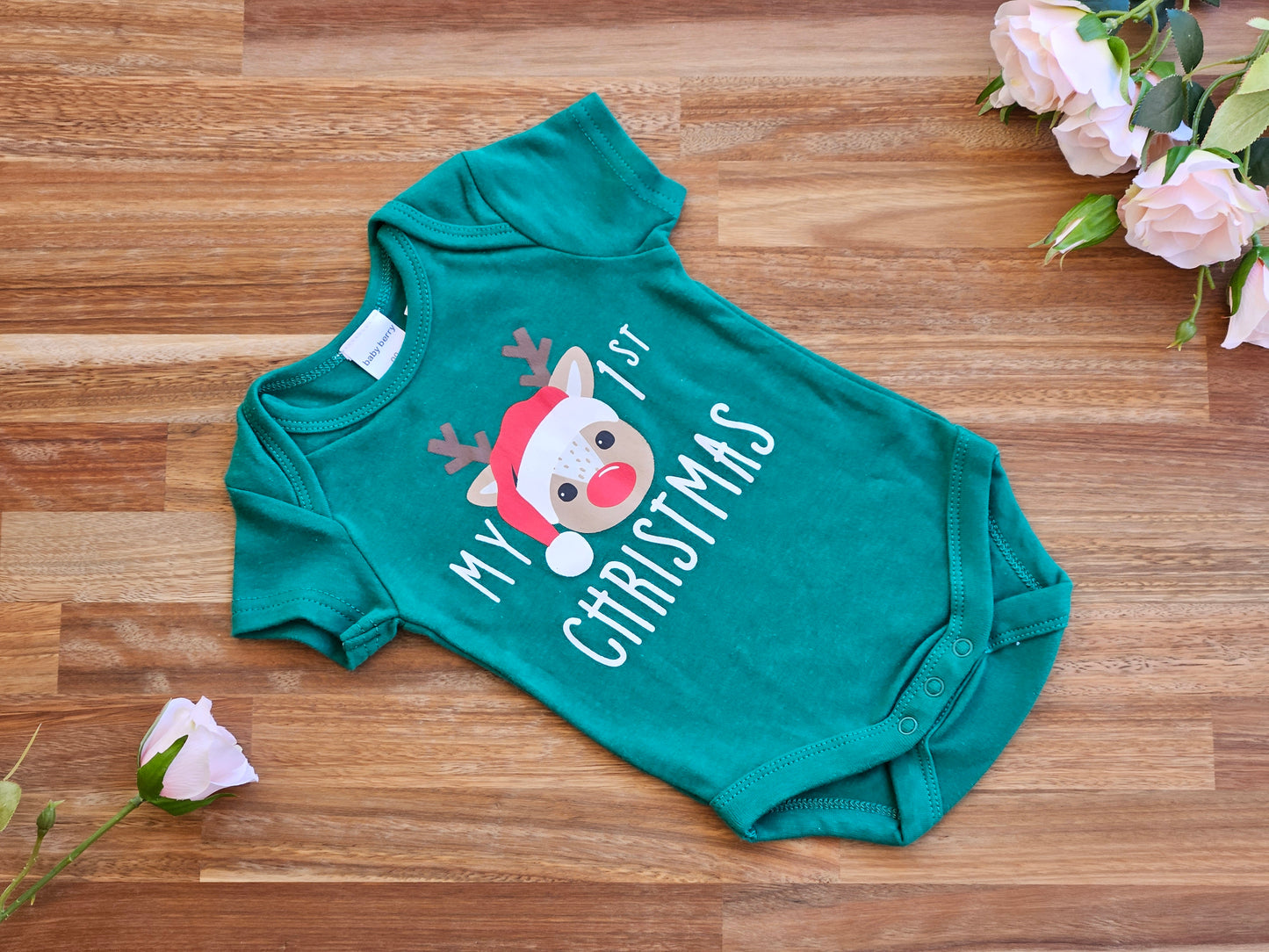 Green romper with Reindeer print