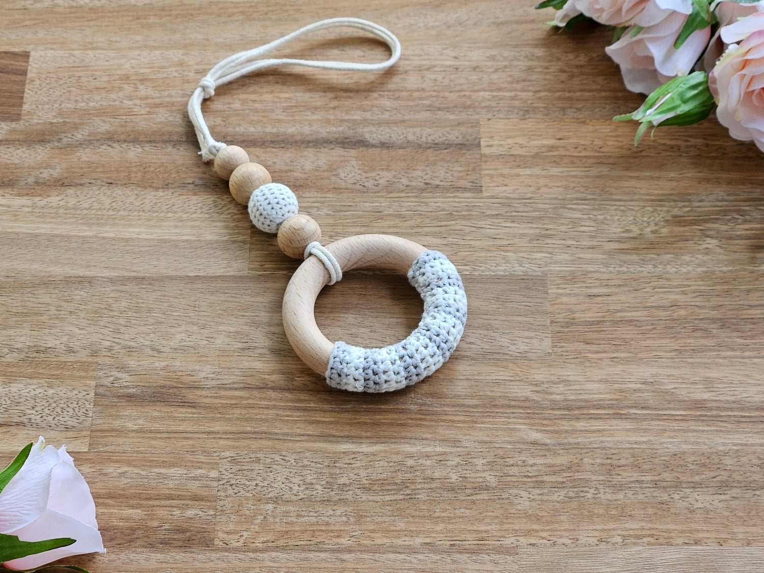 Beaded hanging toy with crocheted ring