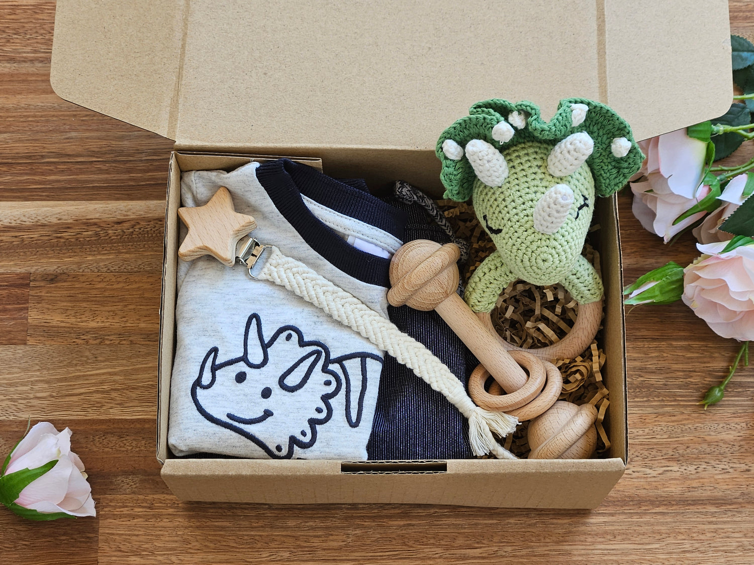 BABY GIFT BOX - Boys dinosaur T shirt with shorts, crocheted triceratops rattle, wooden bar rattle and a macramé pacifier chain