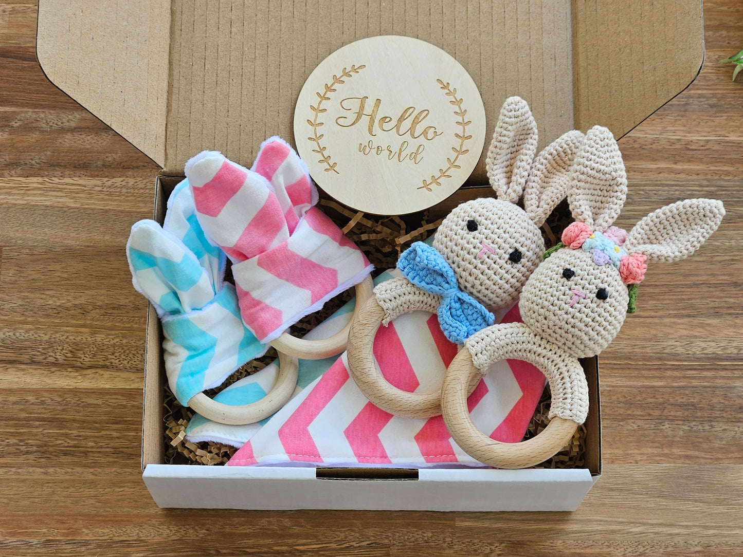 Twin baby boy girl gift box includes 2 bunny rabbit rattles, 2bunny ear teether rings, 2 bandana bibs and a hello world announcement disc