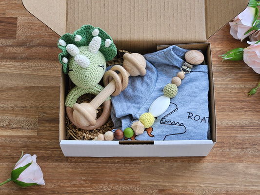 BABY GIFT BOX - Includes light weight grey dinosaur romper , crocheted dinosaur rattle, beaded pacifier chain  and a wooden bar toy