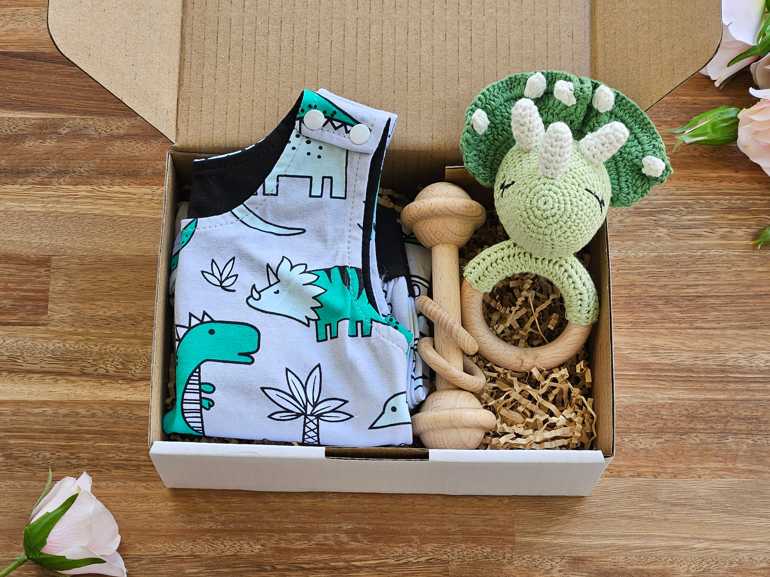 BABY GIFT BOX - Includes  Cotton dinosaur overall style  romper, crocheted dinosaur rattle and a wooden bar toy