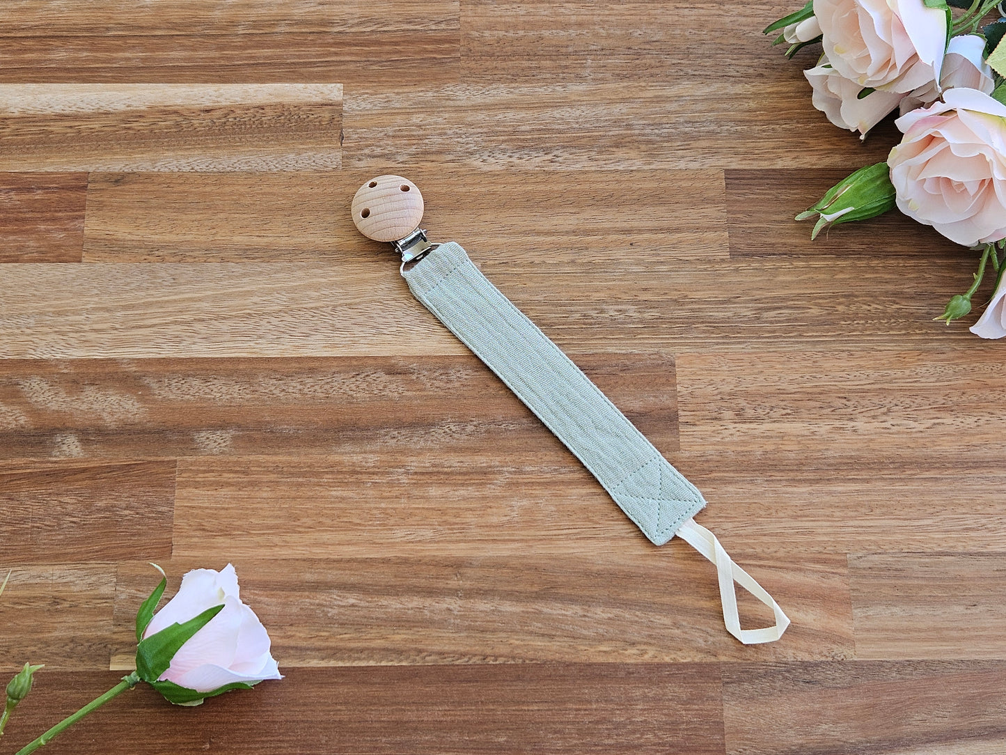 Green muslin pacifier clip