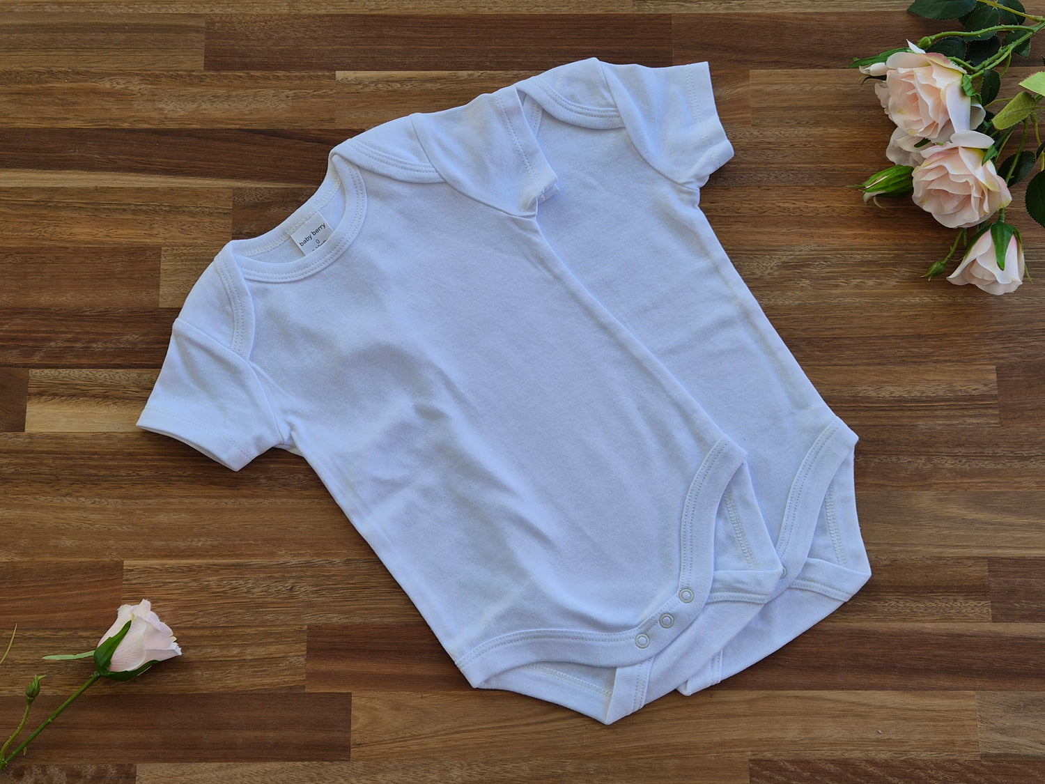 2 white short-sleeve baby bodysuit size 0